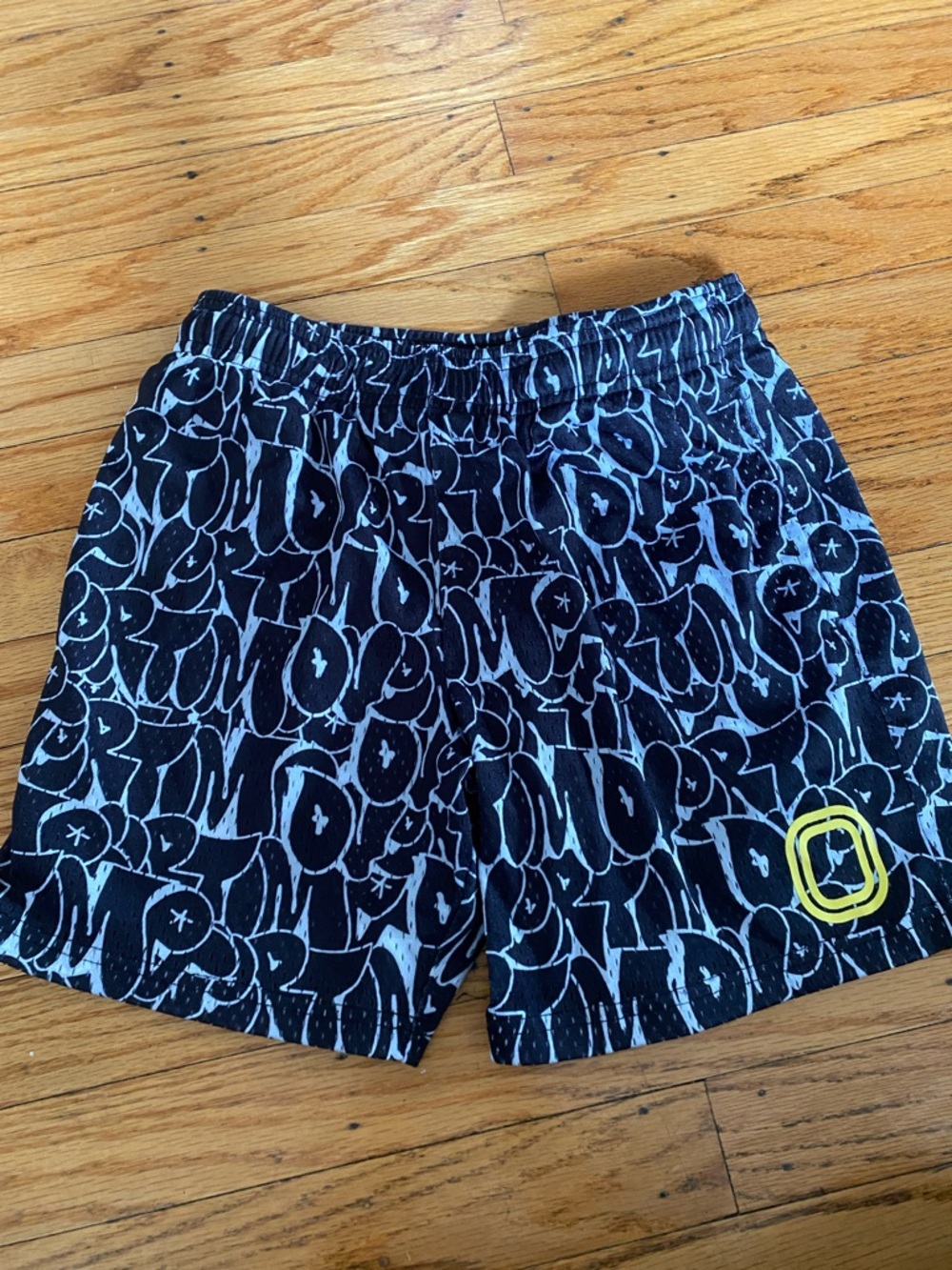 Overtime size YL Black Graffiti-Print Athletic Shorts with Yellow Accent